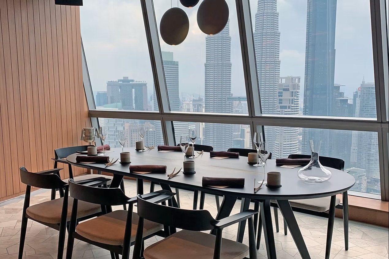 Upscale restaurant dining room with tables and chairs